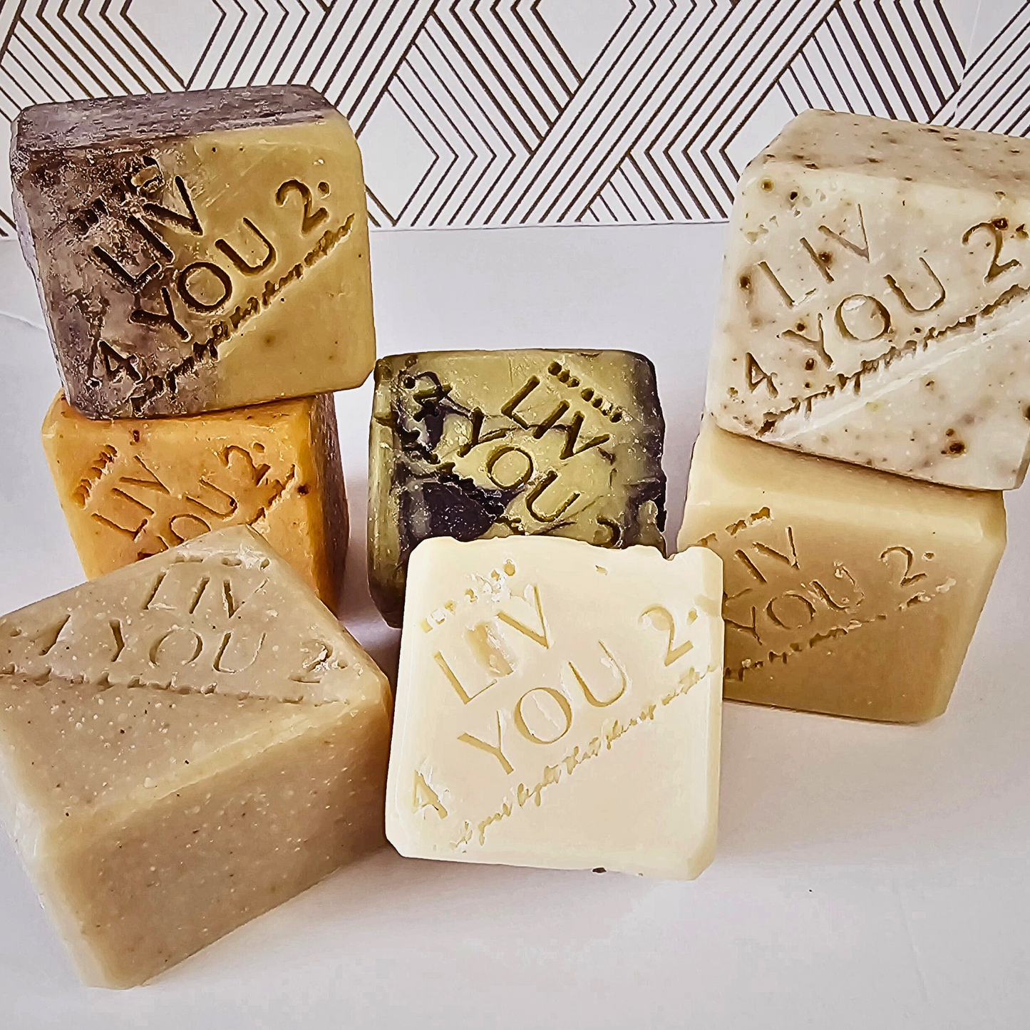 body soap collection for Liv 4 You 2 stamp on white background, 7 square bars of soap shown
