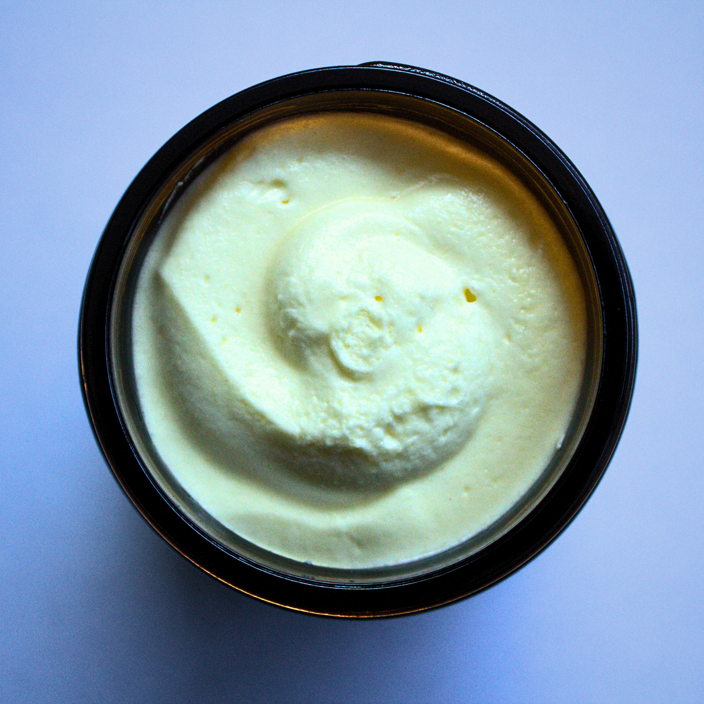 Whipped Tallow Butter in brown glass jar, black top, green and white label, with black writing for Liv 4 You 2